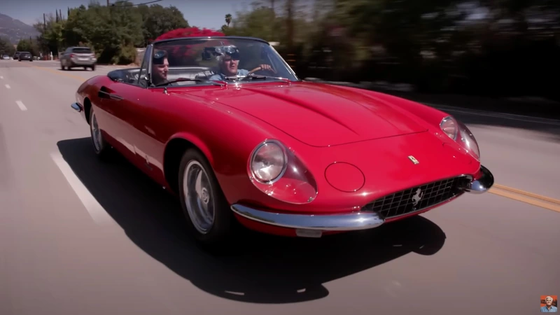 Jay Leno lowers the top of his 1967 Ferrari 365 California Spider.